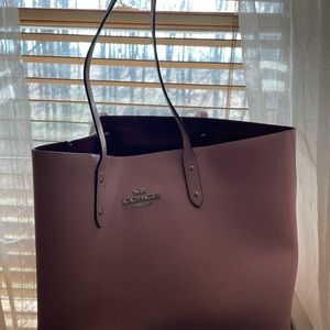 Coach pale pink bag. Inside is made of vinyl material and is easy to wipe down.